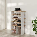 White shoe cabinet with open shelves and lower ribbed cabinet panel