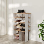 White shoe cabinet with open shelves and lower ribbed cabinet panel
