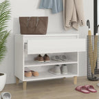 White MDF shoe rack with open shelves and front drawer, holding shoes; light wood feet.