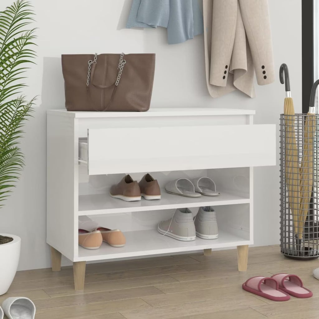 White MDF shoe rack with open shelves and front drawer, holding shoes; light wood feet.