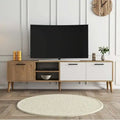 Light wood and white TV table with open media shelf and drawers; holds flat-screen TV