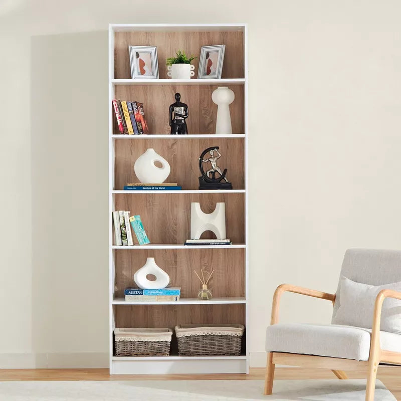Tall white bookshelf with open cubbies, woodgrain panels, and woven baskets on lower shelves
