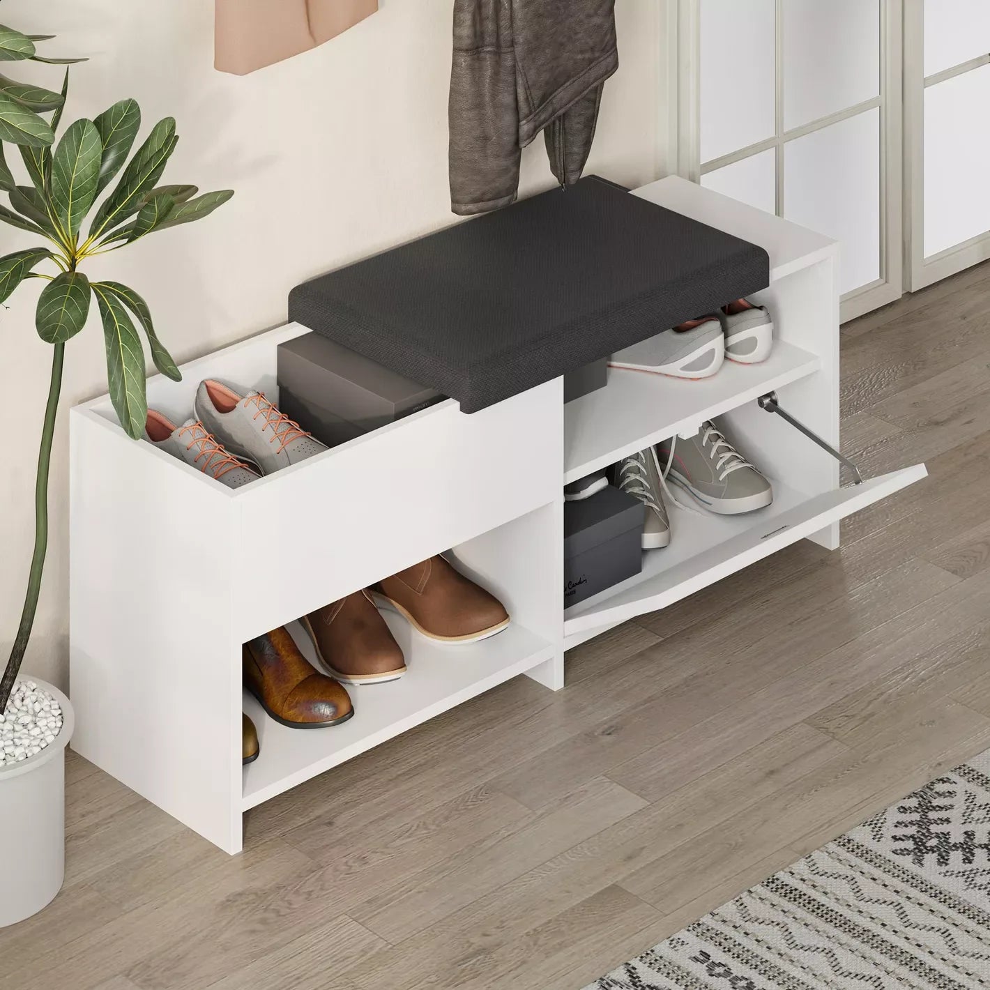 Corner view of white shoe rack with black lid, two open compartments for shoes