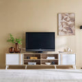 Light wood and white TV table with central open shelves and side cabinet doors