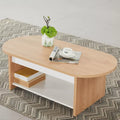 Oval coffee table with light wood top, white side panel, open shelf base.
