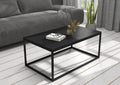 Rectangular coffee table with black MDF top and black metal cross-leg base