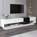 White MDF TV console with black open shelves and two cabinet doors