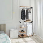Black metal clothes rack with wood shelves, hanging dresses and folded items