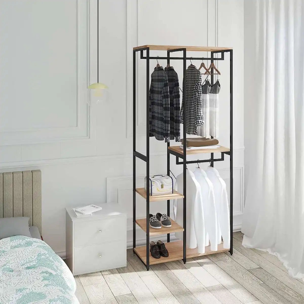 Black metal clothes rack with wood shelves, hanging dresses and folded items
