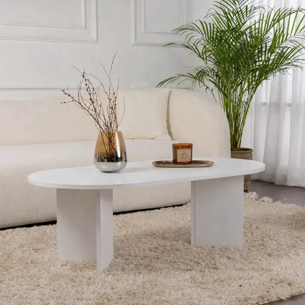 Oval white MDF coffee table with two slender legs