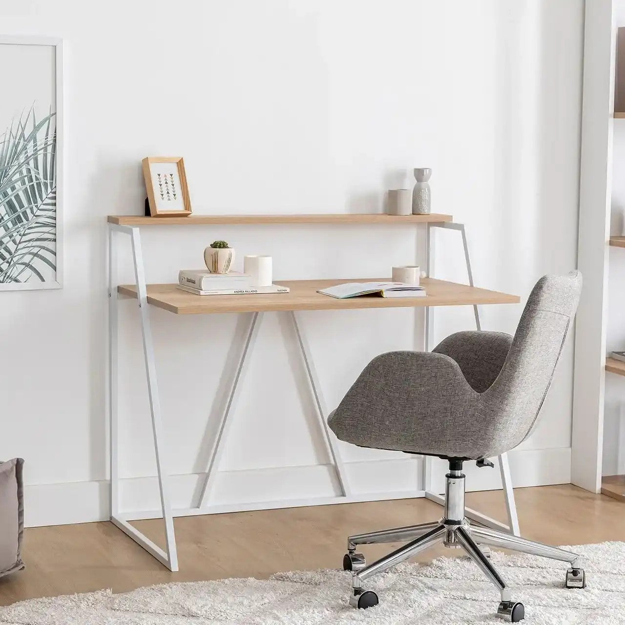Light wood tabletop desk with white metal legs and open shelf under