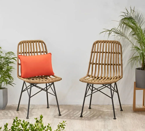 Rattan bamboo cafe chair set of 2 with beige woven backs, red seat cushions, black legs.