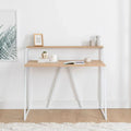NOAH desk with light wood top and white metal frame, open shelf under desk