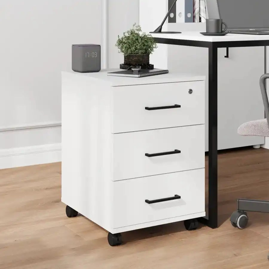White cabinet drawer unit with 3 pull-out drawers and black handles, on caster wheels