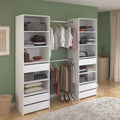 White wardrobe dresser with open shelves, hanging rail, and drawers for folded clothes