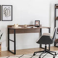 ADAM desk with MDF top, dark metal legs and wood finish; chair beside it