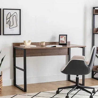 ADAM desk with MDF top, dark metal legs and wood finish; chair beside it