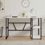 Front view of JESS desk: black metal frame, light MDF top, lower open shelf