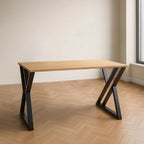 Straight desk with light wood MDF top and black metal frame, side view