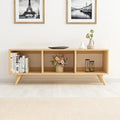 Light wood MDF TV table with open shelving: three compartments, tapered legs.