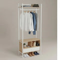 White clothes stand with top rail and open shelves for hanging jackets and shoes