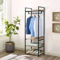 Black metal clothes stand with MDF shelves and top hanging bar, holding shirts and pants