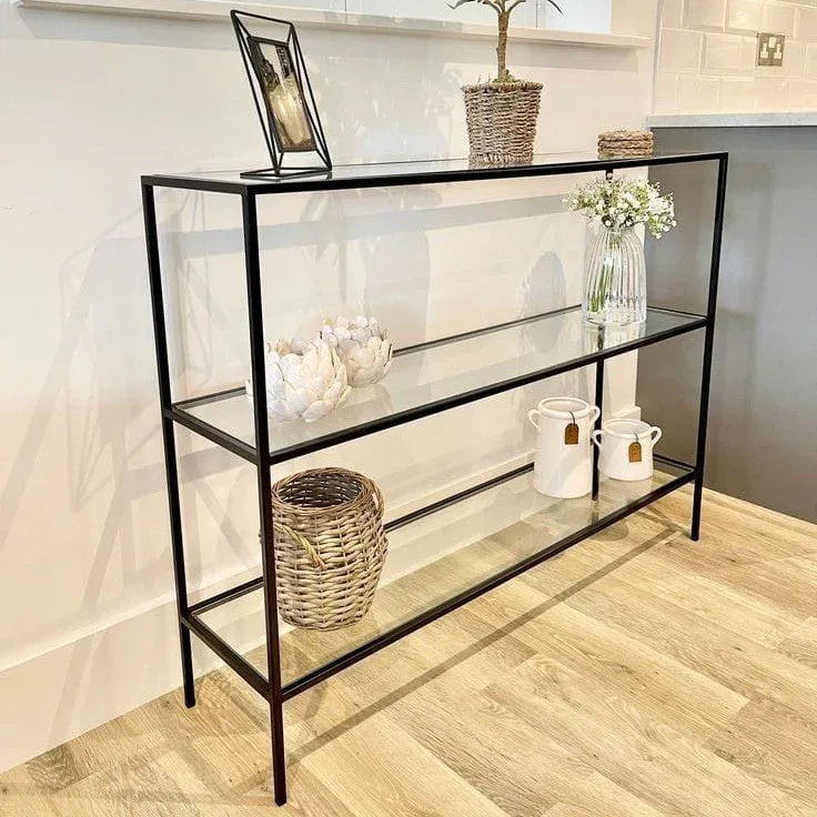 Black metal console table with glass shelves, open shelving unit for entryway