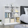 White modern bookcase with open square cubbies and two lower closed panels