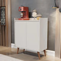 White MDF coffee corner cabinet with two doors and wooden tapered legs.