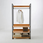 Metal clothes rack with wood shelves, hanging rail, and lower storage bins in frame