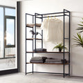 Black metal clothes stand with shelves and side rails for hanging clothes.