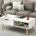 White MDF coffee table with drawer and open shelf, light wood legs, 100x50x40cm