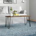 Rectangular coffee table, wood-tone MDF top and black metal legs