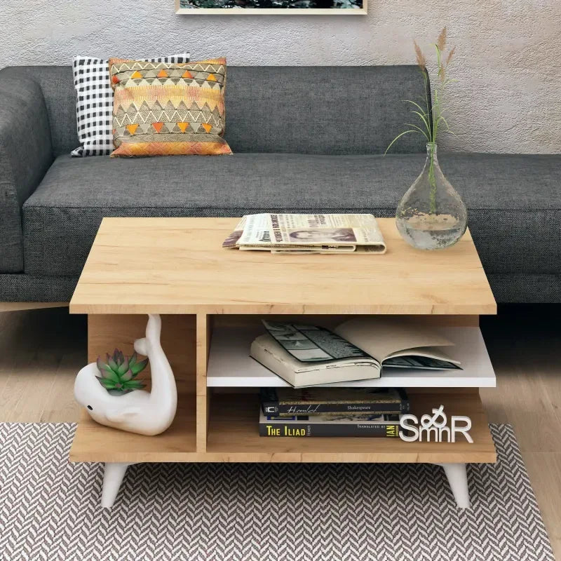 MDF coffee table with light wood top, white legs, and open lower shelf for books