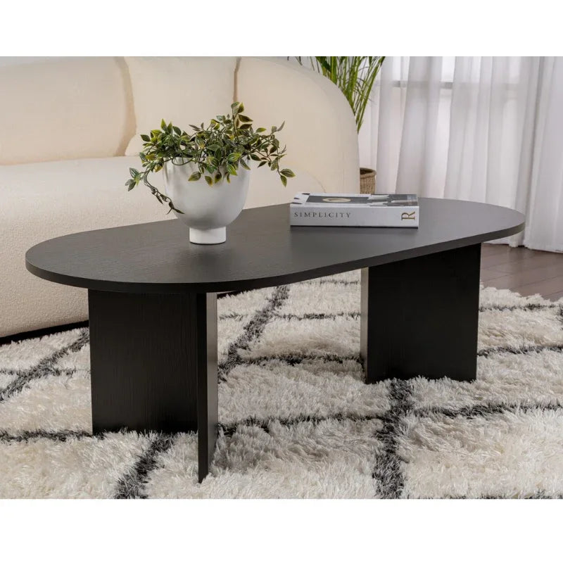 Dark MDF coffee table with rounded oval top and two pedestal legs