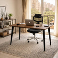 Wood desk with dark metal legs, wide tabletop and black office chair