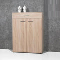 Light wood MDF shoe cabinet with top drawer and two front doors, metal bar handles