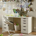 White MDF desk with open center and multiple drawers, black drawer pulls