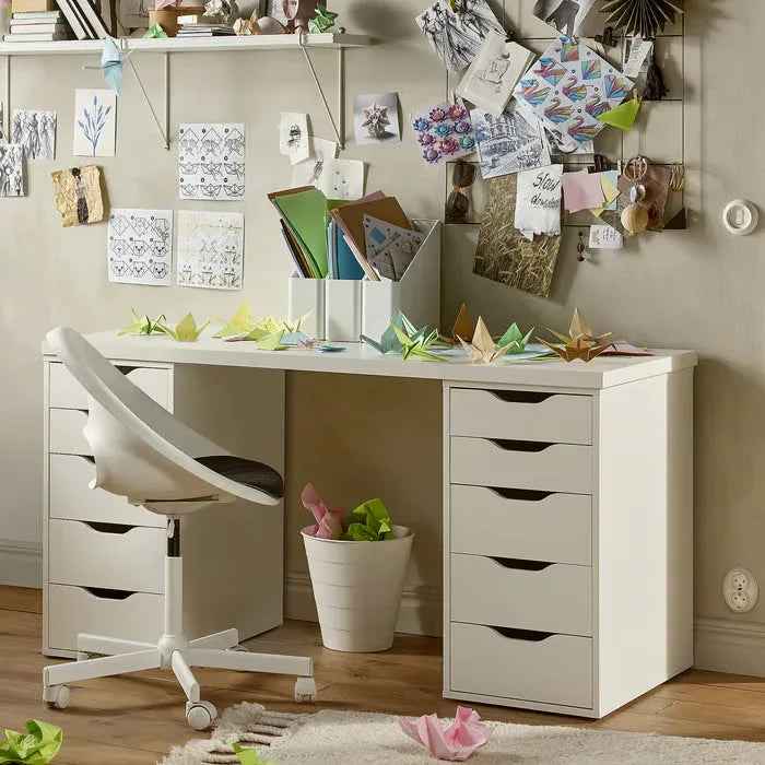 White MDF desk with open center and multiple drawers, black drawer pulls