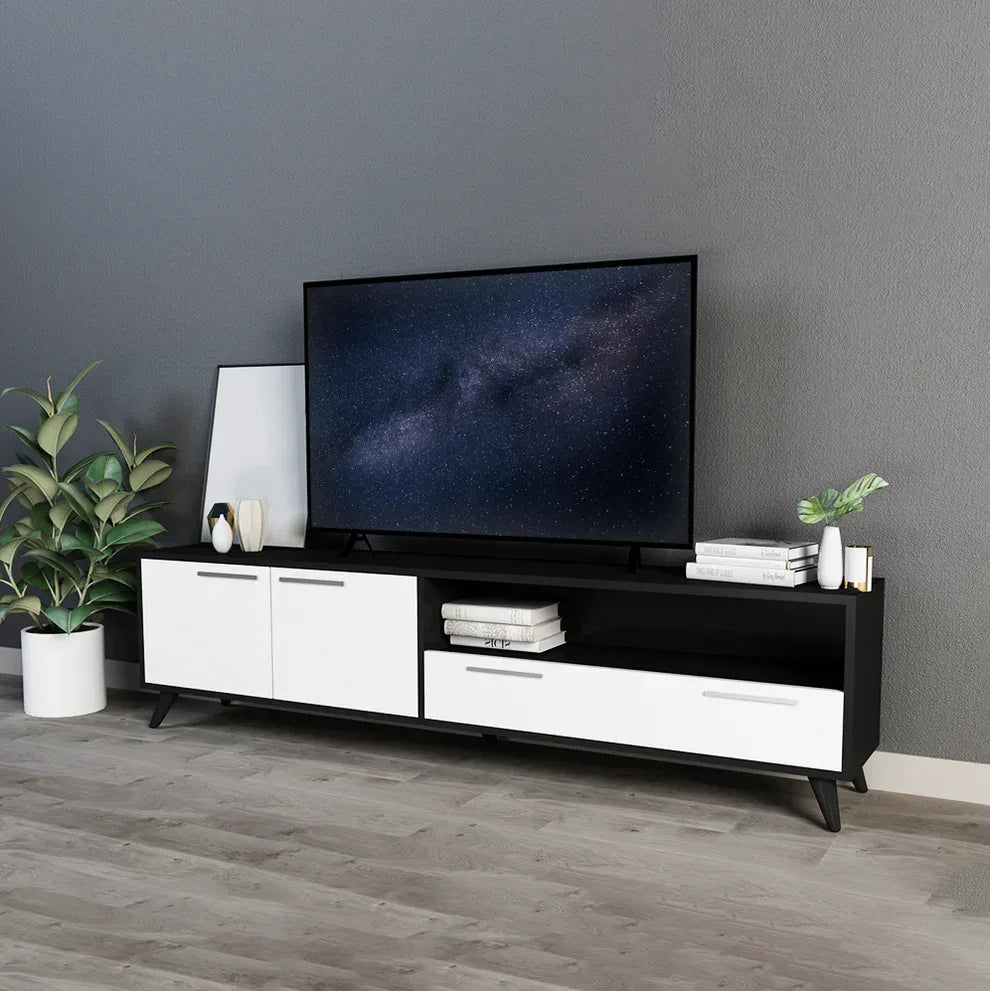 Modern TV media console with black frame, white cabinet doors and drawers, open center shelf