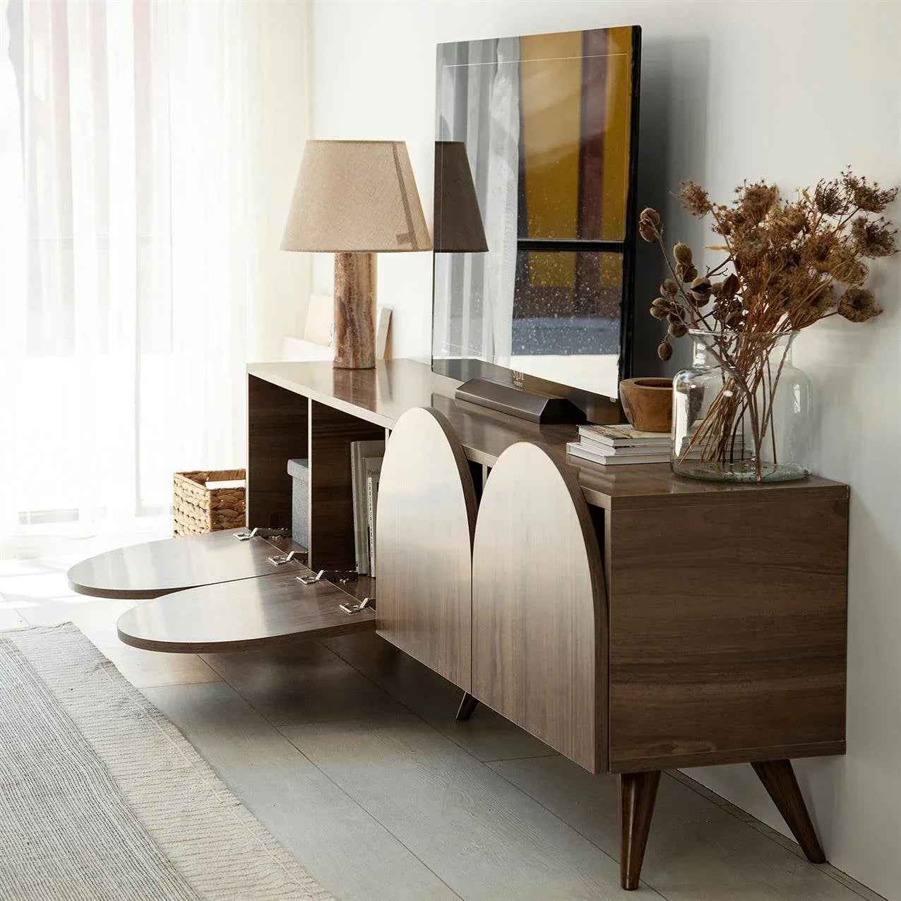 Wood TV media console with arched door panels, drawers, tapered legs
