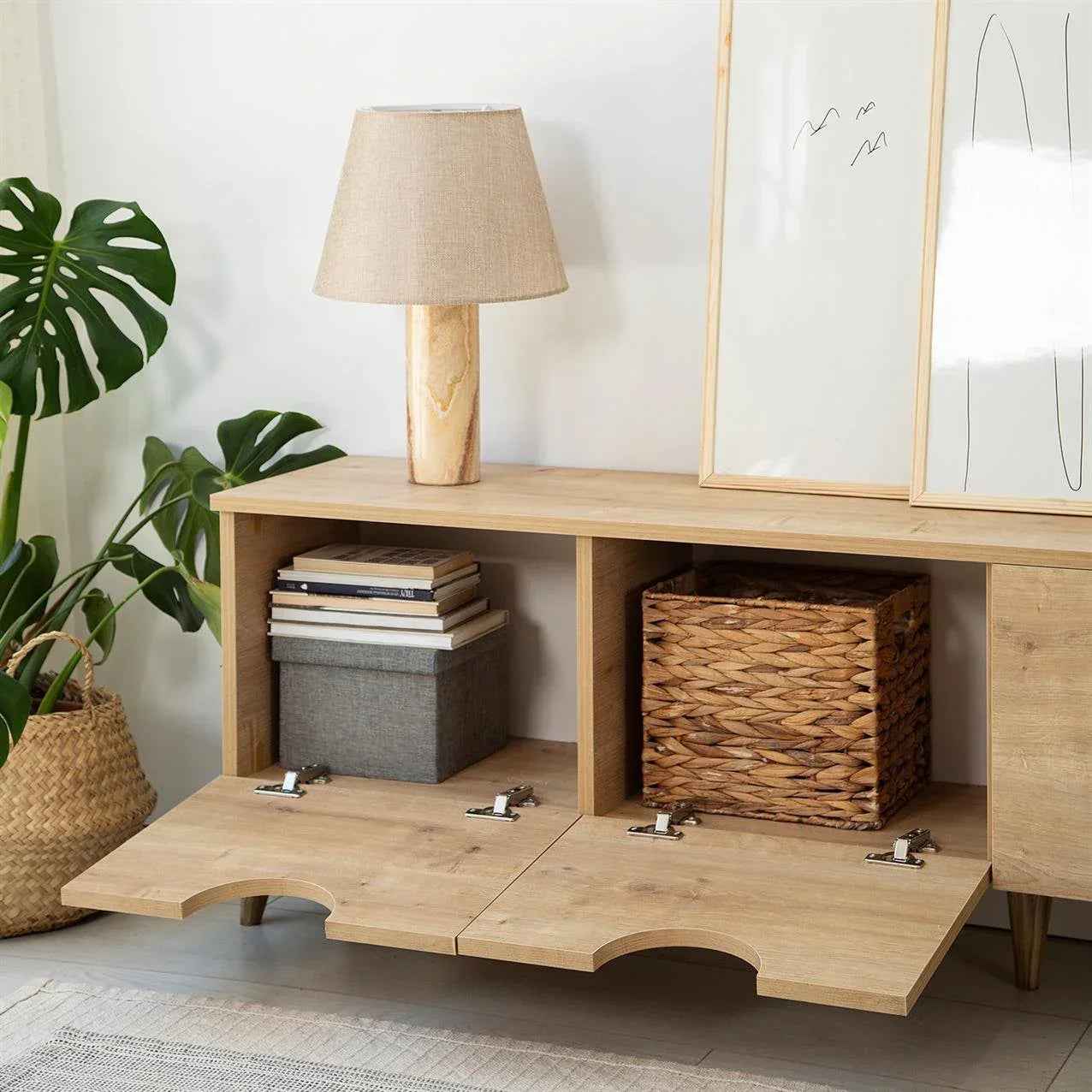 Light wood TV table with two open shelves and removable woven baskets; curved base
