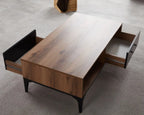 Coffee table side compartments with dark interior, light wood top, black legs