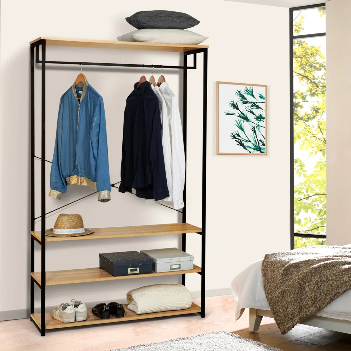 Metal clothing hanger rack with shelves, hanging coats and pants on a top bar