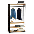 Freestanding metal clothing rack with wood shelves and hanging jackets on bar