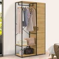 Metal clothes stand with hanging rail, folded blankets on lower shelf, light wood panels