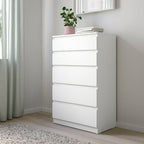 White MDF dresser with four stacked drawers, front view