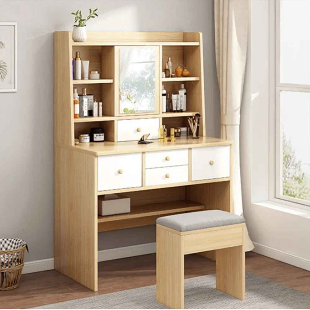 Light wood dressing table with mirror, open shelves, three drawers, and matching stool
