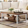 Rectangular coffee table with wood-look top, white legs, and lower shelf in MDF.