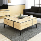 Light wood coffee table with black-trim top and two drawers